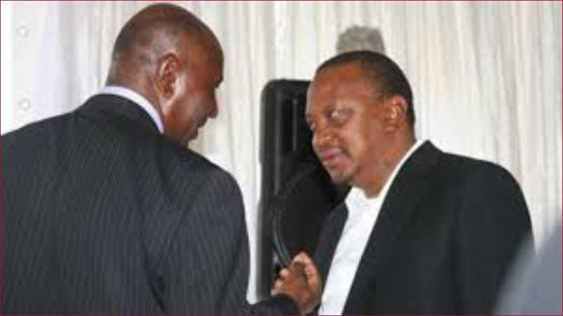 Former Auditor General Edward Ouko shares a moment with former president Uhuru Kenyatta.
